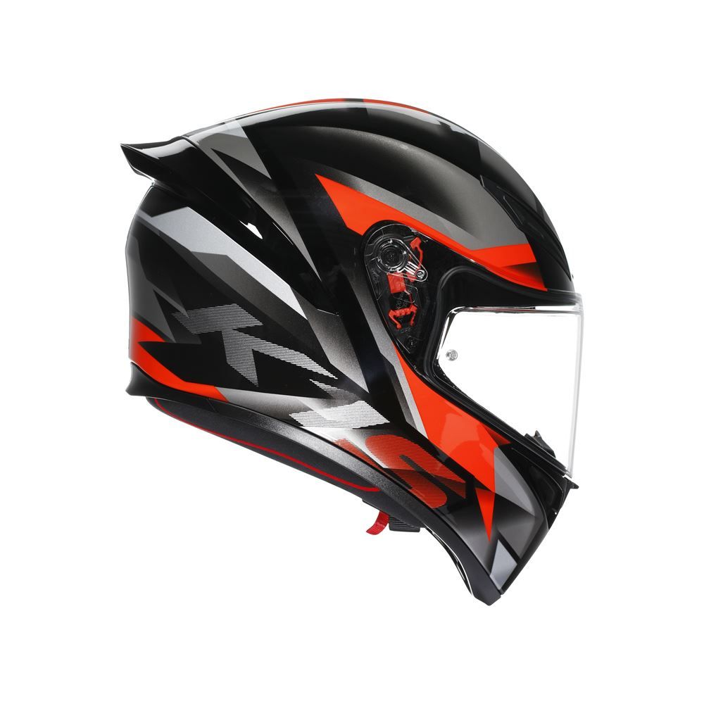 Black, red, and gray motorcycle helmet with clear visor on a white background