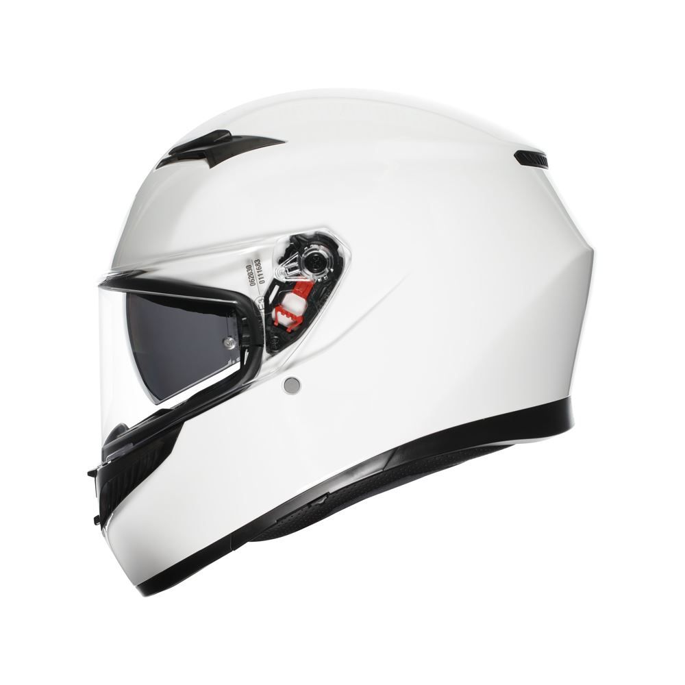 White motorcycle helmet with a clear visor on a white background
