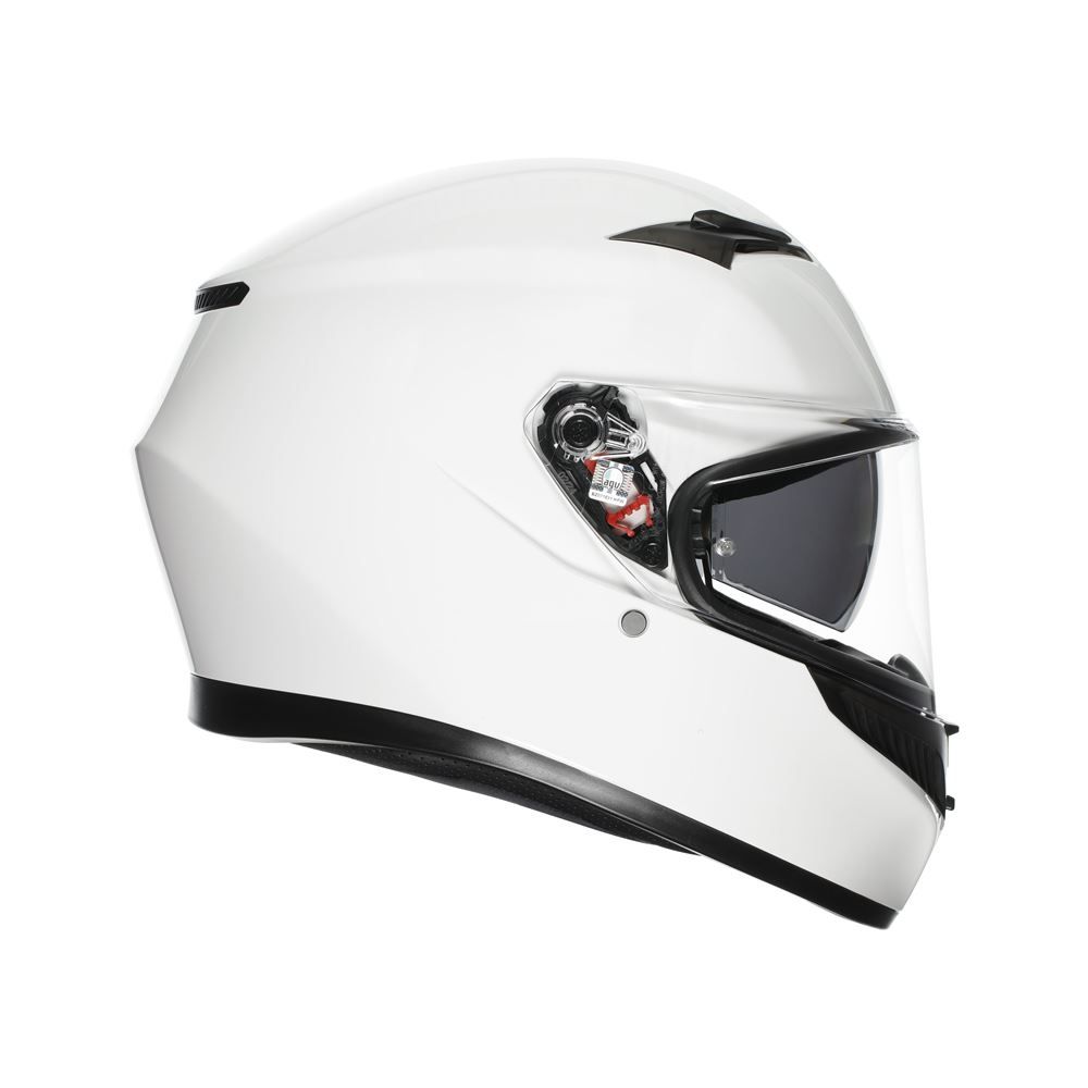 White motorcycle helmet with clear visor on a white background