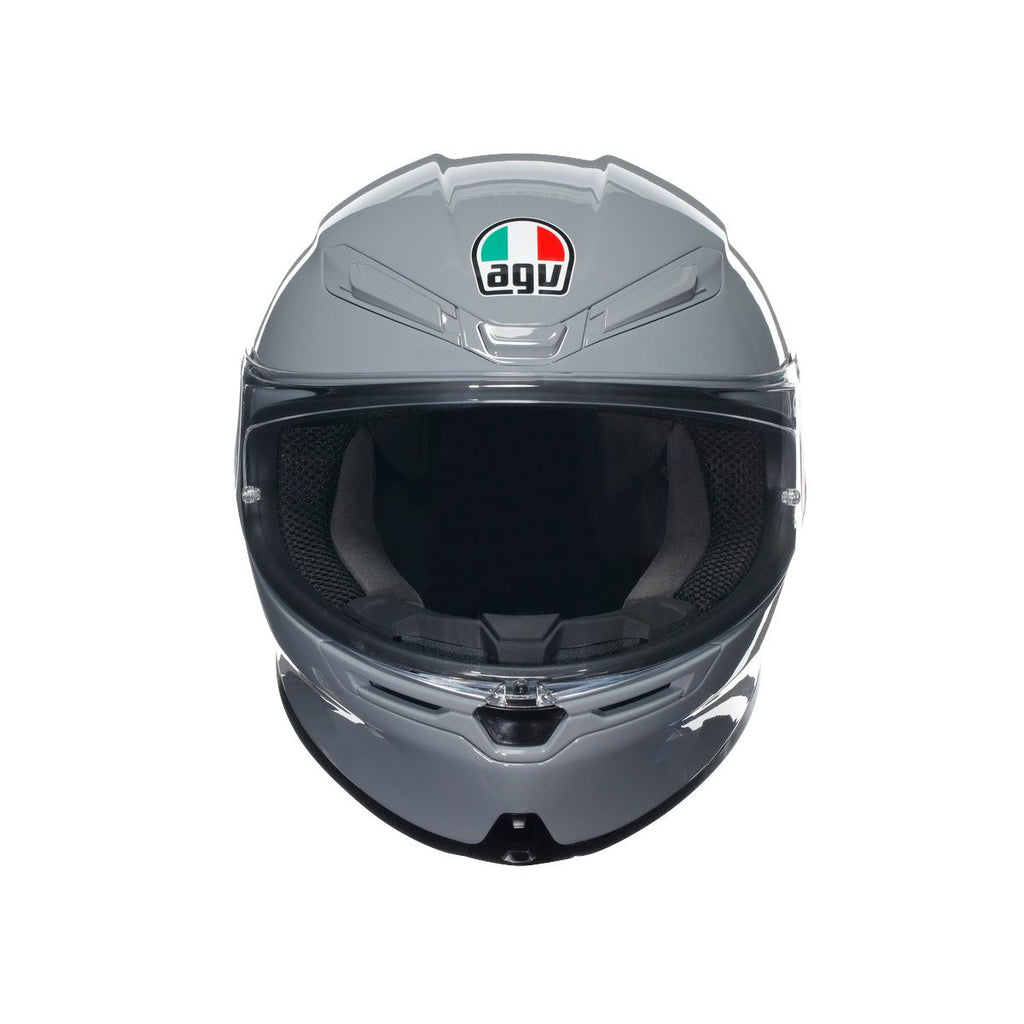 Gray motorcycle helmet with clear visor on a white background